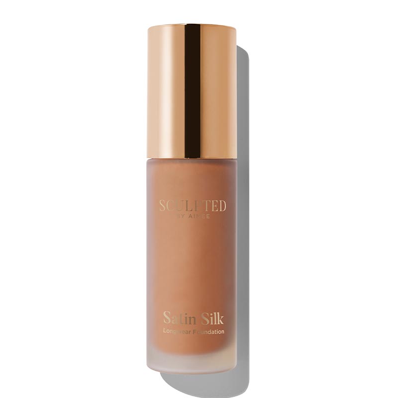 Sculpted By Aimee Connolly Satin Silk Longwear Foundation | radiant | medium to high coverage | flawless base | feels lightweight | skin | satin silk finish | glides smoothly | complexion | won't clog pores | Infused with skin-loving ingredients | hydrating formula | nourished | plump | foundation | sit comfortably | 8+ hours.