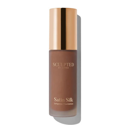 Sculpted By Aimee Connolly Satin Silk Longwear Foundation | radiant | medium to high coverage | flawless base | feels lightweight | skin | satin silk finish | glides smoothly | complexion | won't clog pores | Infused with skin-loving ingredients | hydrating formula | nourished | plump | foundation | sit comfortably | 8+ hours.