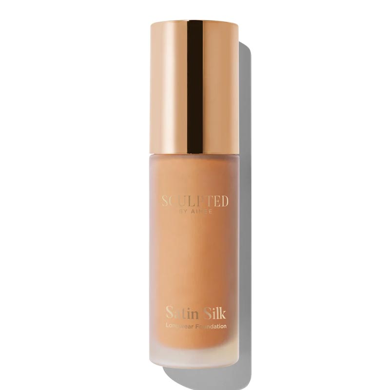 Sculpted By Aimee Connolly Satin Silk Longwear Foundation | radiant | medium to high coverage | flawless base | feels lightweight | skin | satin silk finish | glides smoothly | complexion | won't clog pores | Infused with skin-loving ingredients | hydrating formula | nourished | plump | foundation | sit comfortably | 8+ hours.